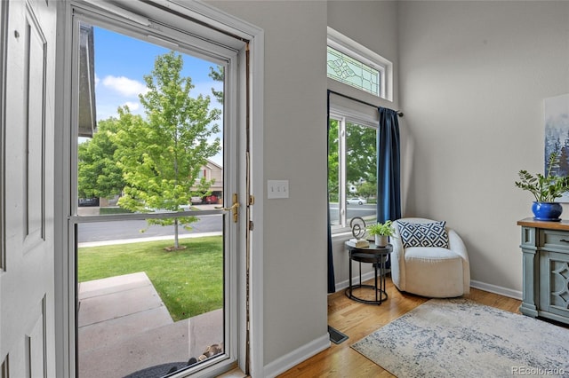 11188 Latigo Ln, Parker, CO 80138 - doorway to outside featuring wood finished floors and baseboards