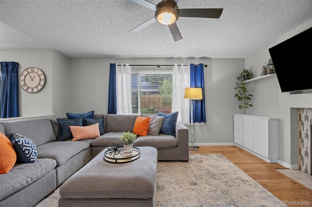 11188 Latigo Ln, Parker, CO 80138 - living room with ceiling fan, wood finished floors, baseboards, and a textured ceiling