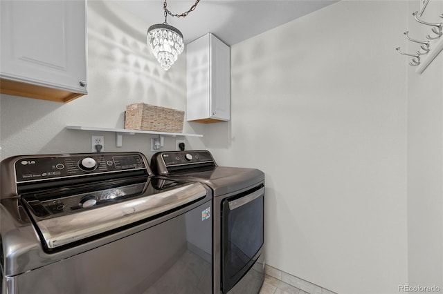 11188 Latigo Ln, Parker, CO 80138 - washroom featuring washing machine and clothes dryer, cabinet space, a chandelier, light tile patterned floors, and baseboards
