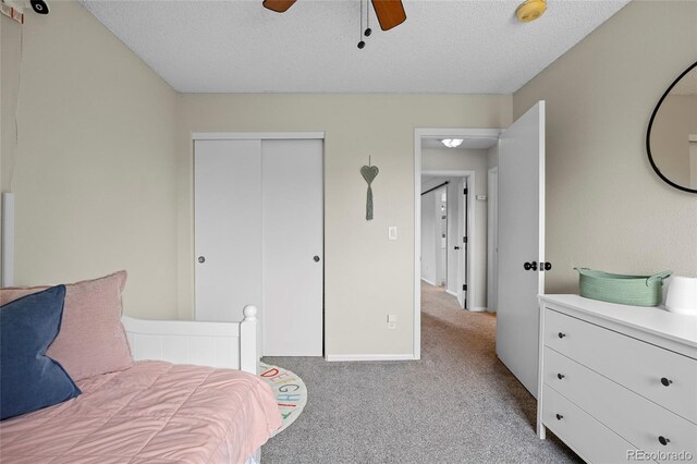 11188 Latigo Ln, Parker, CO 80138 - carpeted bedroom with a closet, a textured ceiling, and ceiling fan