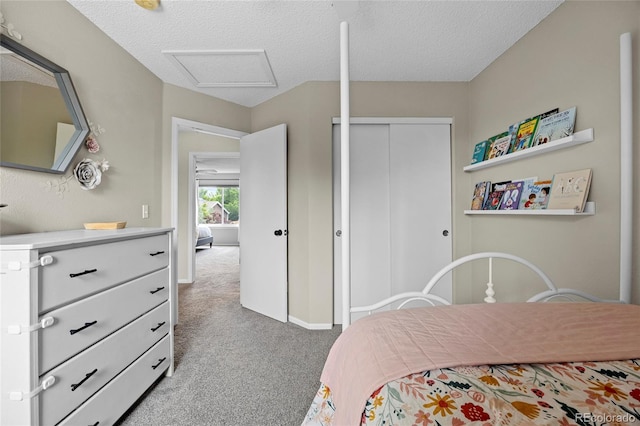 11188 Latigo Ln, Parker, CO 80138 - bedroom featuring carpet floors, a closet, attic access, a textured ceiling, and baseboards