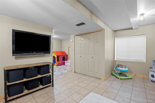 11188 Latigo Ln, Parker, CO 80138 - recreation room with light tile patterned flooring and baseboards