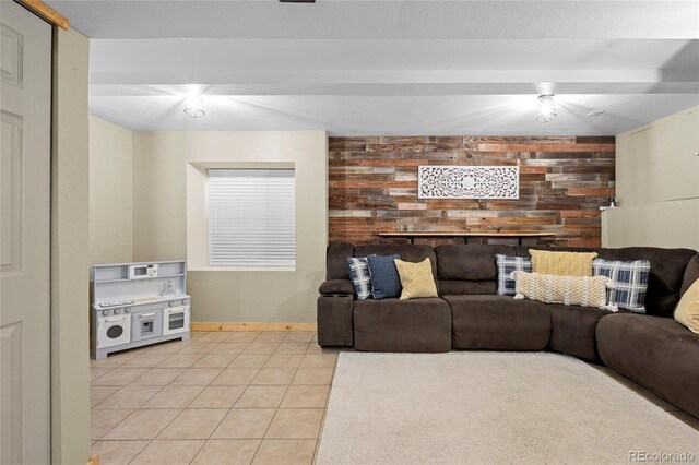 11188 Latigo Ln, Parker, CO 80138 - living room featuring light tile patterned floors, baseboards, and wood walls