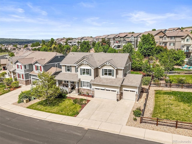 2090 Bellavista St, Castle Rock, CO 80109 - view of front of house with a residential view, a tiled roof, concrete driveway, and a garage