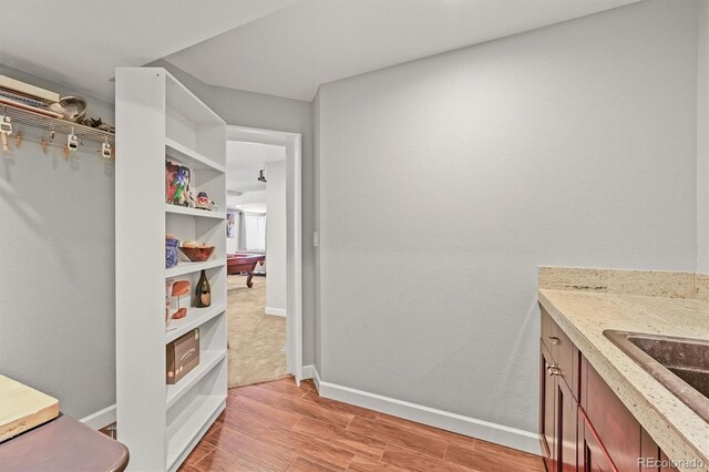 2090 Bellavista St, Castle Rock, CO 80109 - bathroom featuring vanity, wood finished floors, and baseboards