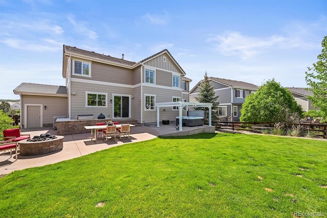 2090 Bellavista St, Castle Rock, CO 80109 - back of house with a fire pit, a patio area, a hot tub, board and batten siding, and a pergola