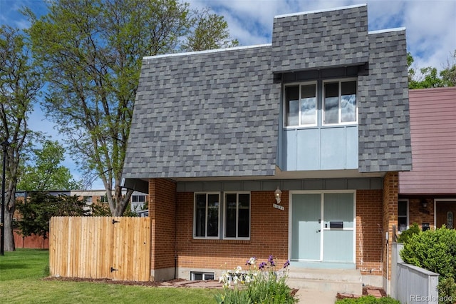 11651 Pennsylvania St, Northglenn, CO 80233 - view of front of home featuring roof with shingles, brick siding, and mansard roof