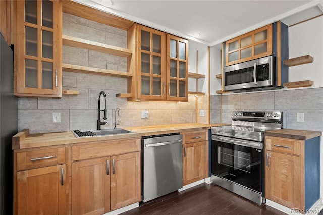 11651 Pennsylvania St, Northglenn, CO 80233 - kitchen featuring open shelves, appliances with stainless steel finishes, butcher block counters, a sink, and dark wood finished floors