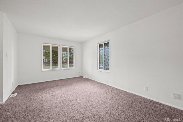 11651 Pennsylvania St, Northglenn, CO 80233 - carpeted spare room featuring plenty of natural light and baseboards