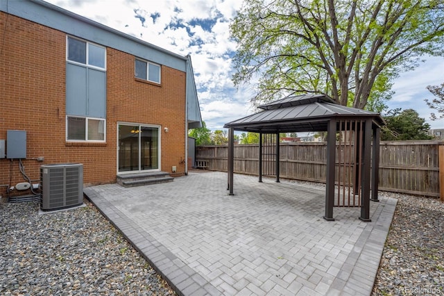 11651 Pennsylvania St, Northglenn, CO 80233 - fenced backyard with central air condition unit, a gazebo, a patio area, and entry steps