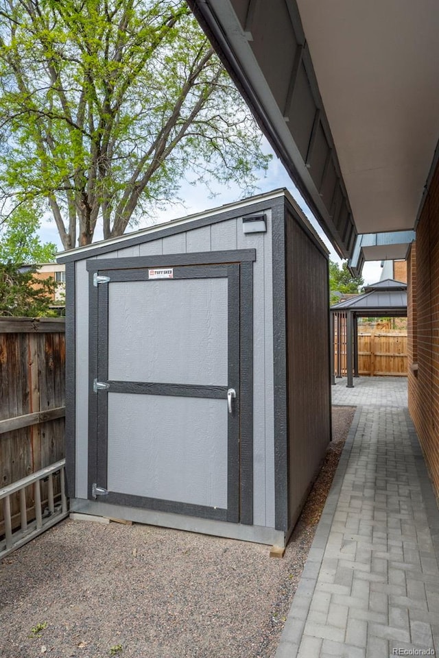 11651 Pennsylvania St, Northglenn, CO 80233 - view of shed featuring a gazebo and a fenced backyard