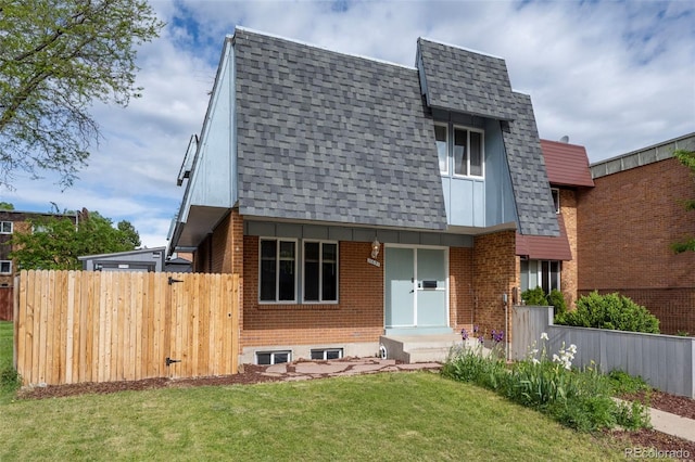 11651 Pennsylvania St, Northglenn, CO 80233 - view of front facade with a shingled roof and brick siding