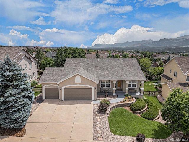 149 Walters Creek Dr, Monument, CO 80132 - view of front of home with an attached garage, a porch, concrete driveway, stucco siding, and a front yard