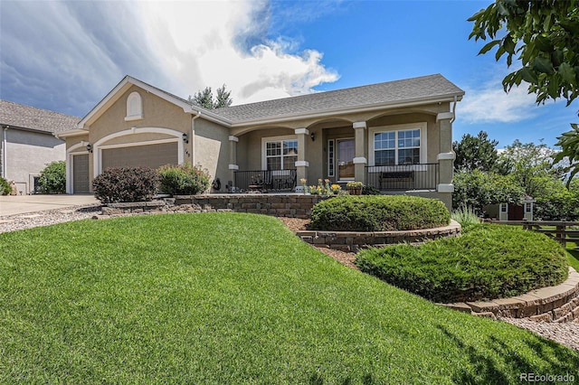 149 Walters Creek Dr, Monument, CO 80132 - ranch-style house with stucco siding, an attached garage, a front lawn, driveway, and a porch