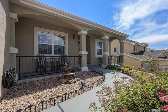 149 Walters Creek Dr, Monument, CO 80132 - property entrance with a porch and stucco siding