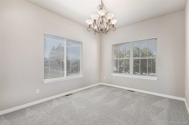 149 Walters Creek Dr, Monument, CO 80132 - spare room with a chandelier and carpet floors