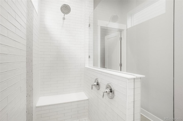 bathroom featuring tiled shower