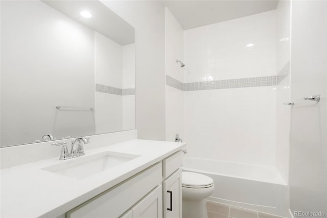 full bathroom with toilet, vanity, tile patterned floors, and tiled shower / bath