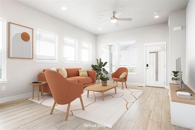 living room featuring light wood-type flooring and ceiling fan