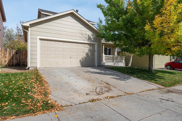 view of front of house featuring a porch and a garage