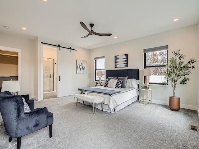 carpeted bedroom with recessed lighting, visible vents, baseboards, and a barn door