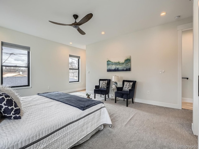 carpeted bedroom featuring ceiling fan, baseboards, and recessed lighting