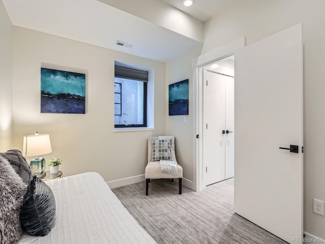 bedroom with carpet, visible vents, and baseboards