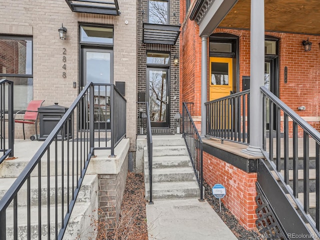 entrance to property with brick siding