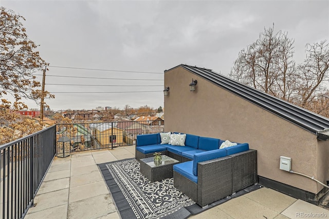 view of patio featuring an outdoor hangout area and a balcony