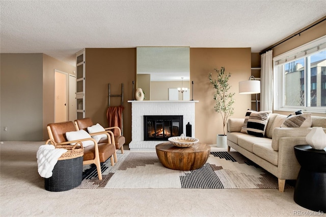 living room with a textured ceiling, light carpet, and a brick fireplace