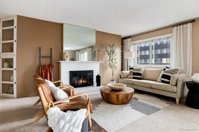 living room with light carpet, a textured ceiling, and a brick fireplace