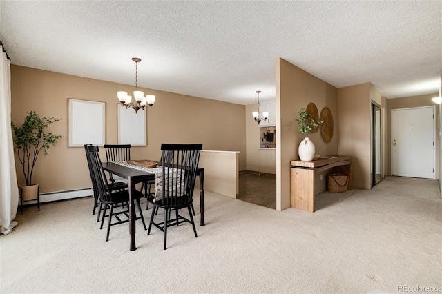 carpeted dining space featuring a textured ceiling, a baseboard radiator, and an inviting chandelier