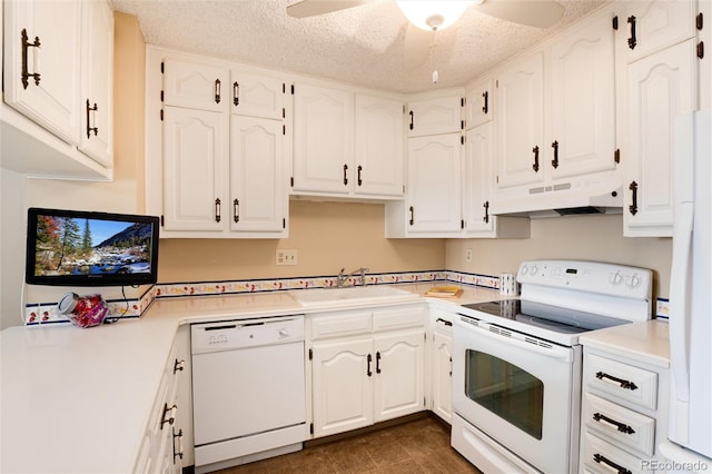 kitchen with a textured ceiling, sink, white cabinets, and white appliances