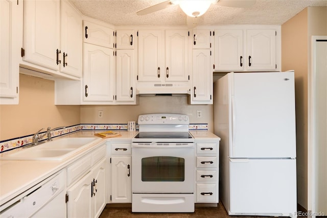 kitchen featuring white appliances, sink, ceiling fan, a textured ceiling, and white cabinetry