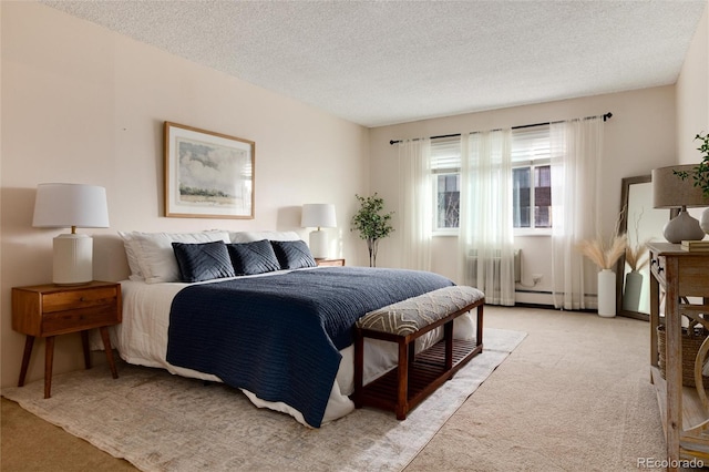 bedroom featuring light colored carpet and a textured ceiling