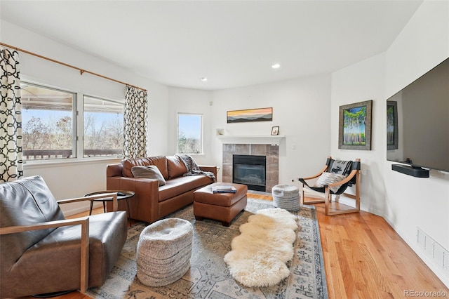 4212 E Orchard Pl, Centennial, CO 80121 - living room with wood finished floors, a tile fireplace, recessed lighting, and baseboards