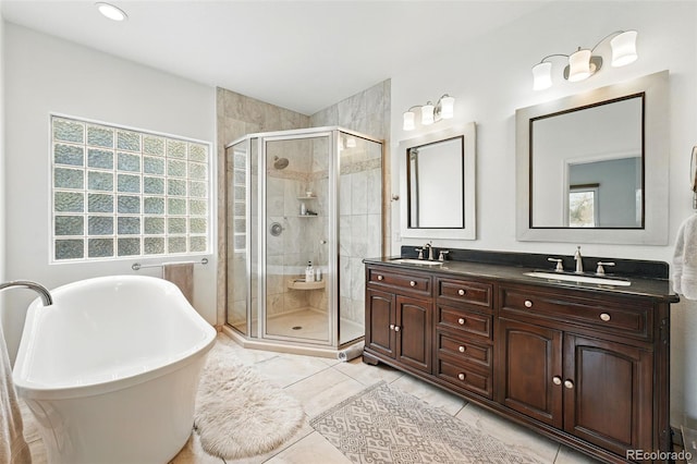 4212 E Orchard Pl, Centennial, CO 80121 - full bath featuring a stall shower, healthy amount of natural light, and a soaking tub