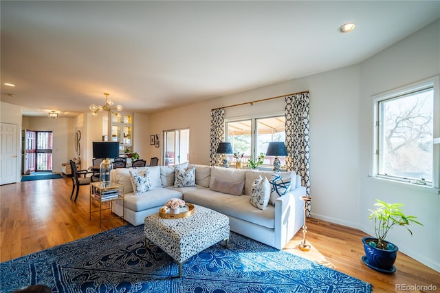 4212 E Orchard Pl, Centennial, CO 80121 - living area featuring healthy amount of natural light, a chandelier, wood finished floors, baseboards, and recessed lighting