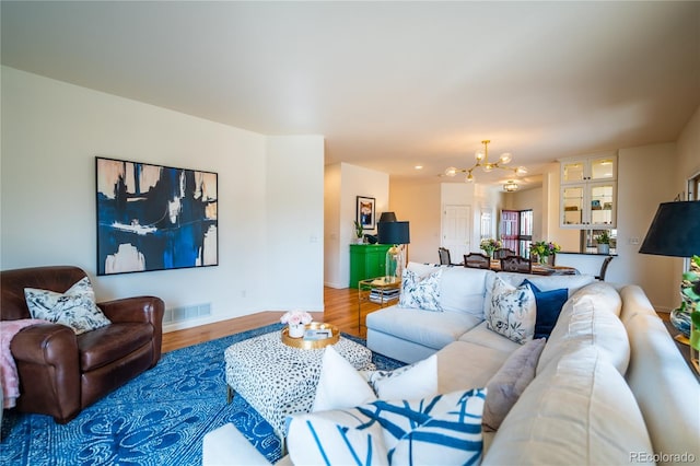 4212 E Orchard Pl, Centennial, CO 80121 - living room featuring a chandelier and wood finished floors