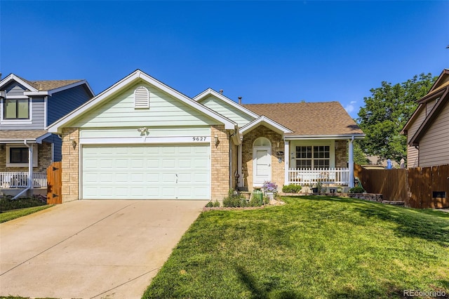 9627 Franklin St, Thornton, CO 80229 - view of front of house with covered porch, brick siding, concrete driveway, and a garage