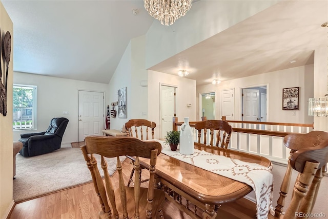 9627 Franklin St, Thornton, CO 80229 - dining area with a chandelier, light wood-type flooring, and high vaulted ceiling