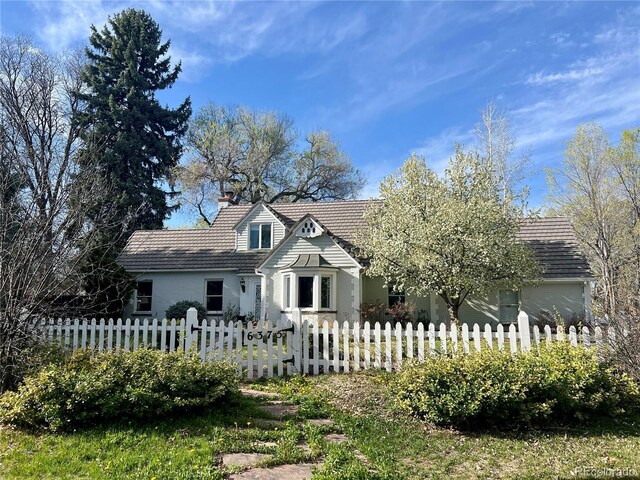 6375 E 6th Avenue Parkway, Denver, CO 80220 - view of front of house featuring a fenced front yard and a chimney