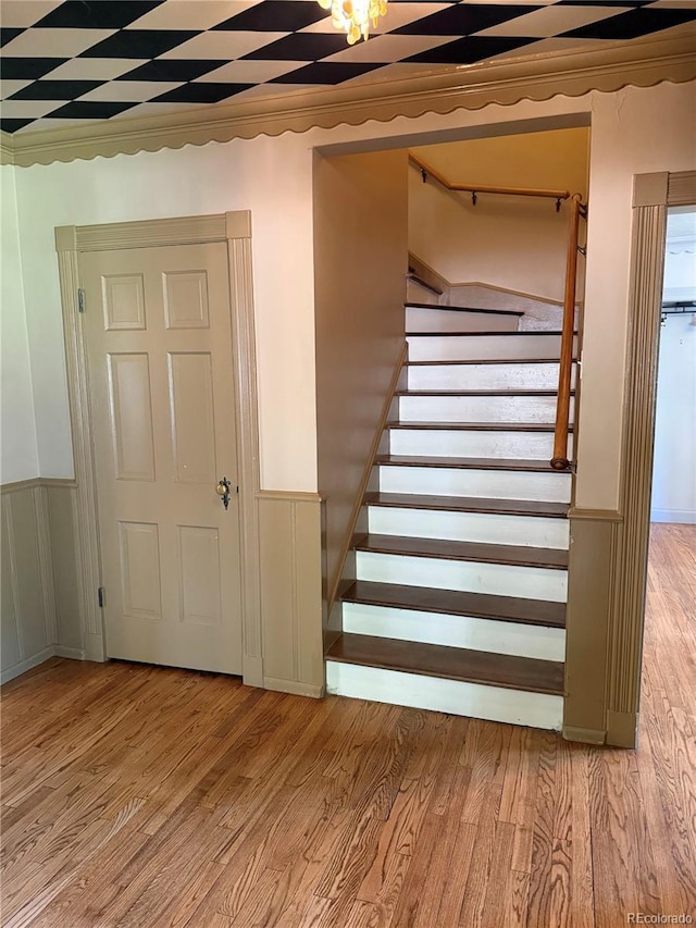 6375 E 6th Avenue Parkway, Denver, CO 80220 - staircase with wood finished floors and a wainscoted wall