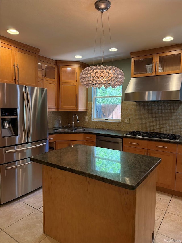 6375 E 6th Avenue Parkway, Denver, CO 80220 - kitchen featuring appliances with stainless steel finishes, under cabinet range hood, light tile patterned floors, a kitchen island, and recessed lighting