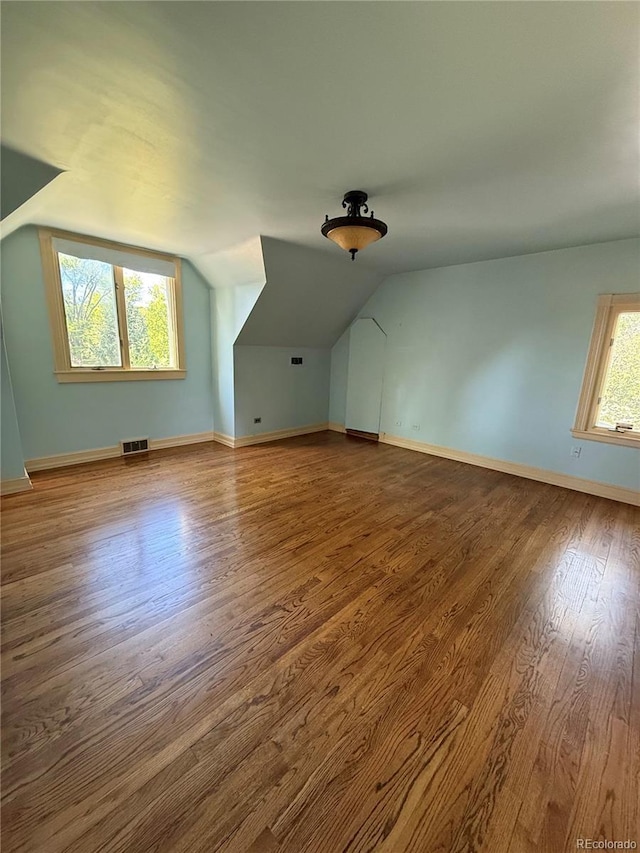 6375 E 6th Avenue Parkway, Denver, CO 80220 - bonus room featuring wood finished floors and vaulted ceiling