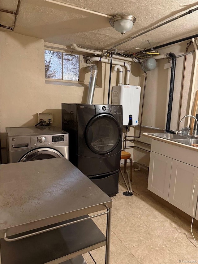 6375 E 6th Avenue Parkway, Denver, CO 80220 - laundry room featuring tankless water heater, washing machine and dryer, cabinet space, and light tile patterned flooring