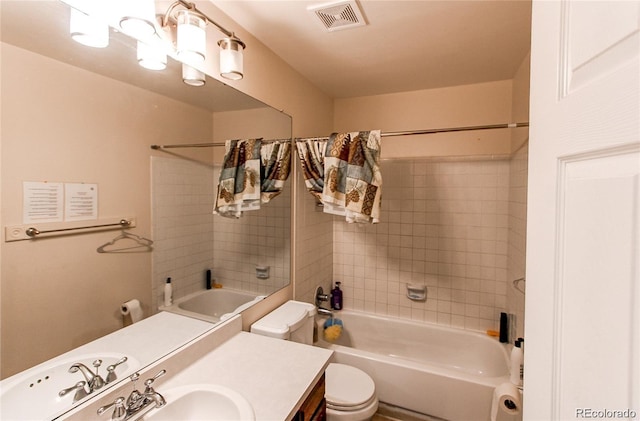 full bathroom featuring toilet, shower / tub combo, and vanity