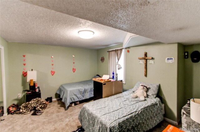 carpeted bedroom with a textured ceiling