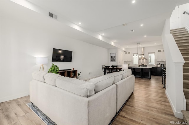 living room with light hardwood / wood-style floors