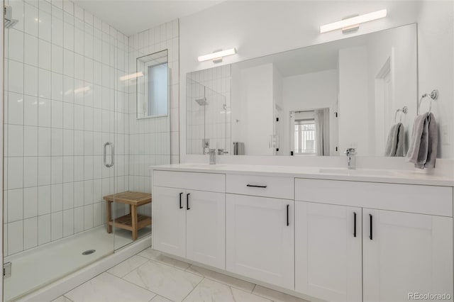 bathroom featuring vanity and an enclosed shower